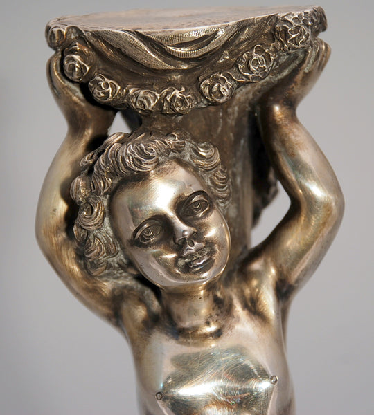 Silver Statue of a Cherub with Wreath of Flowers